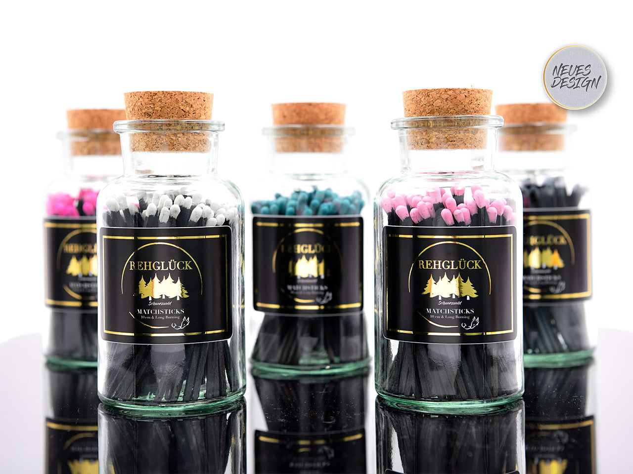 Apothekerflasche mit schwarzen Streichhölzern