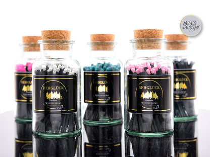 Apothekerflasche mit schwarzen Streichhölzern