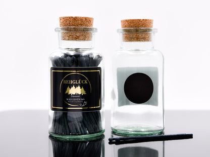 Apothekerflasche mit schwarzen Streichhölzern
