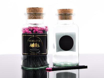Apothekerflasche mit schwarzen Streichhölzern/Pink