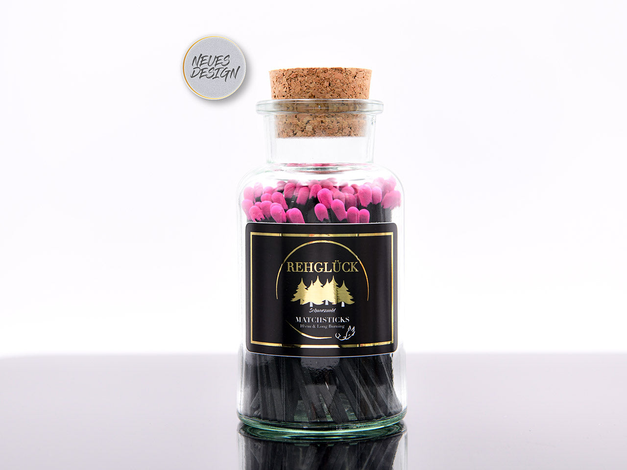 Apothekerflasche mit schwarzen Streichhölzern/Pink
