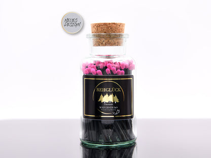 Apothekerflasche mit schwarzen Streichhölzern/Pink