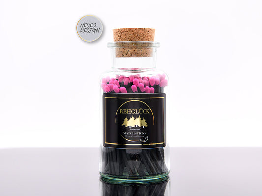 Apothekerflasche mit schwarzen Streichhölzern/Pink