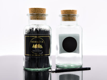 Apothekerflasche mit schwarzen Streichhölzern/Weiß