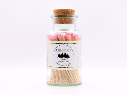 Apothekerflasche mit hellen Streichhölzern/Rosa