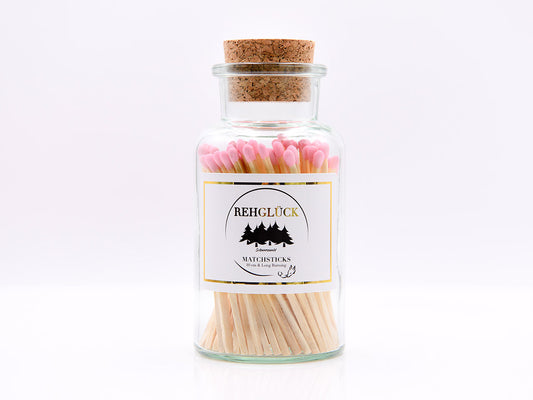 Apothekerflasche mit hellen Streichhölzern/Rosa