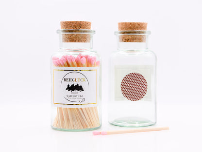 Apothekerflasche mit hellen Streichhölzern/Rosa