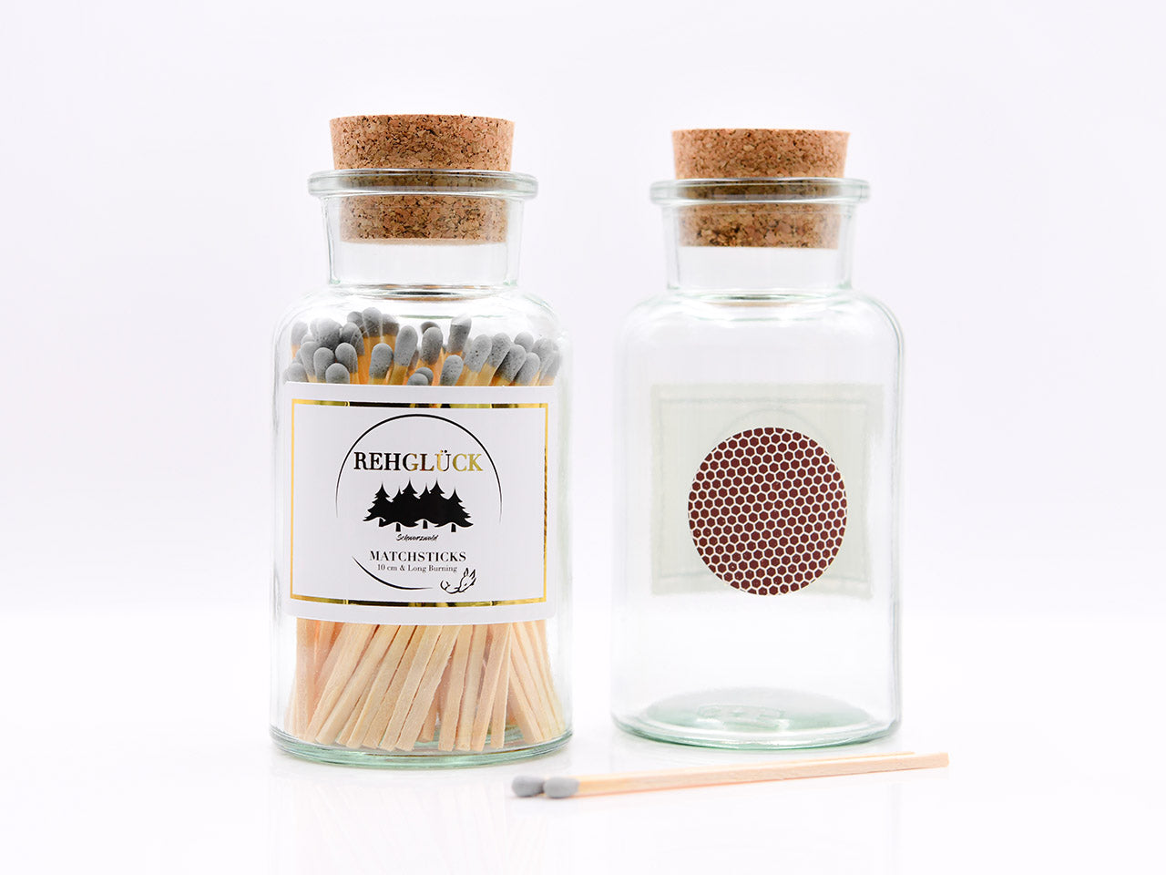Apothekerflasche mit hellen Streichhölzern/Grau