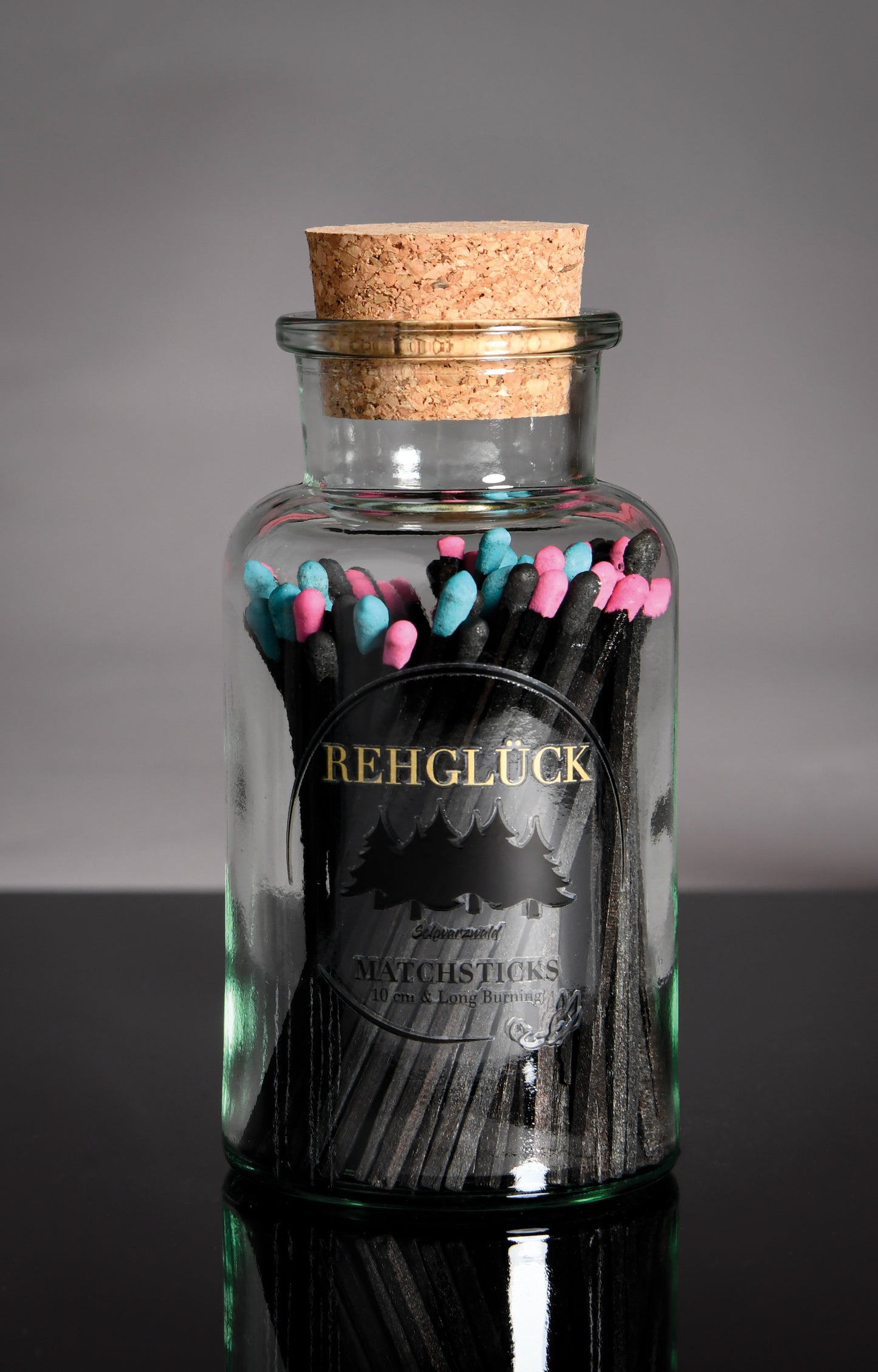 Apothekerflasche mit schwarzen Streichhölzern/Gemischt