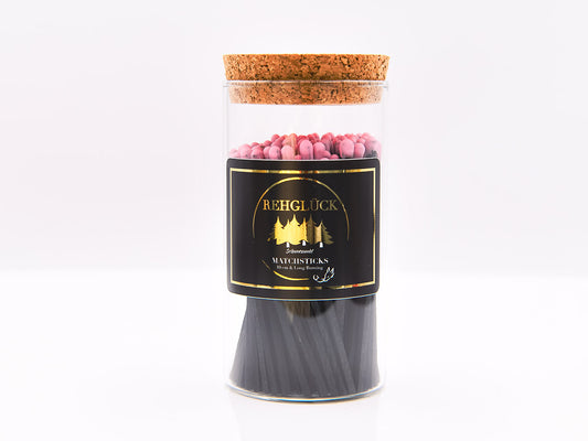 Zylinderglas schwarze Streichhölzer/hell rosa Kopf
